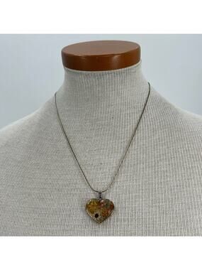 Sterling silver pressed flowered in a resin heart necklace